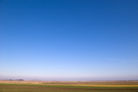 beautiful blue sky and a country fieldの写真素材