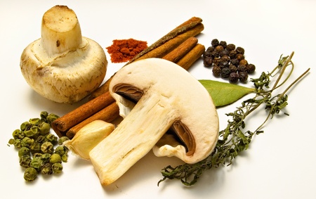 a few ingredients and spices on white backgroundの写真素材