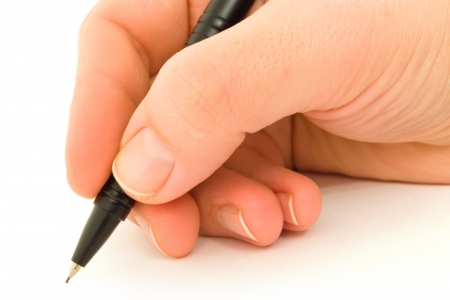 Hand writing with black mechanical pencil on whiteの写真素材