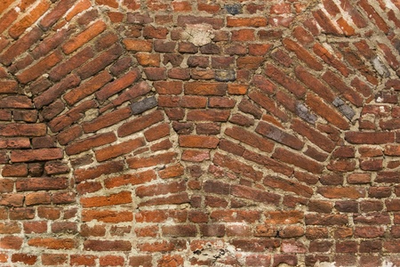 old red brick wall with archs base