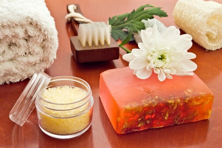 towell brush loofah sea-salt sopa and flower arrangementの写真素材