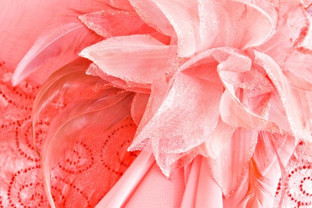 flower made of fabric and feathers on pink night dressの写真素材
