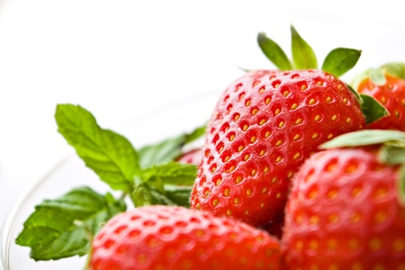 macro of strawberries on white with shallow depth of fieldの写真素材