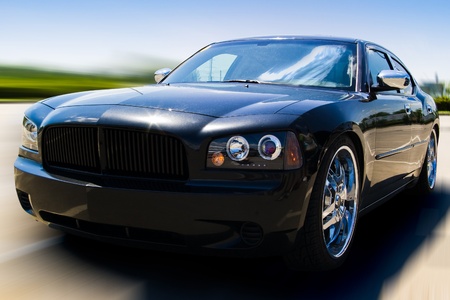 black power car driving fast - isolated with clipping pathの写真素材