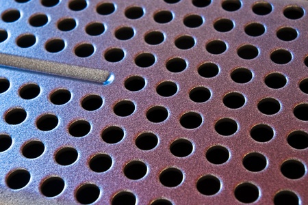 abstract metal texture with holesの写真素材