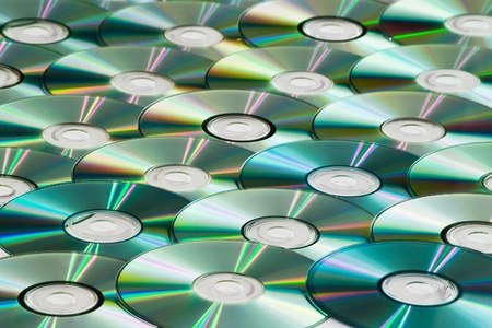 CDs with colored reflections for background