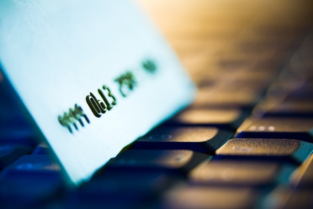 credit card on laptop keyboard with shallow depth of field