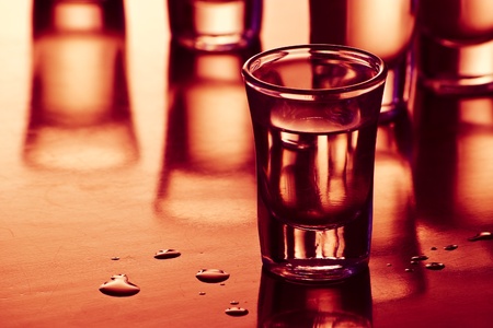 drink shots with reflection and drops in bar
