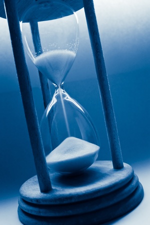 time concept with hourglass blue tintedの写真素材