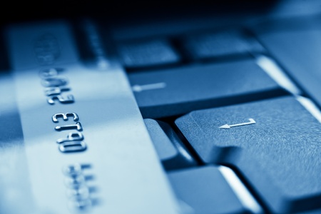 enter key and credit card blue toned
