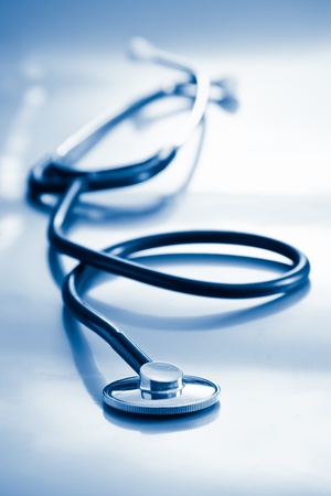 medical stethoscope on surface blue tonedの写真素材