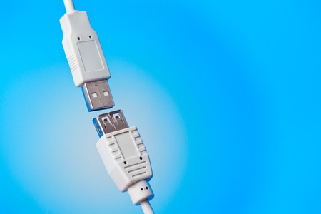 closeup shot of two unplugged usb connectors on blue