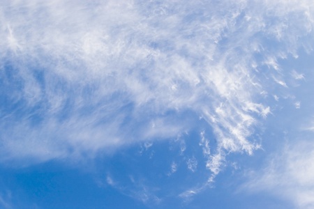 fluffy clouds on blue skyの写真素材