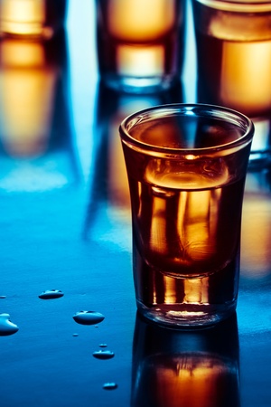tequila drink on tap room in blue lightの写真素材