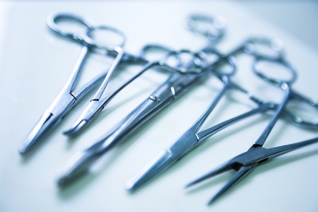 medical clamp instruments on table with shallow depth of fieldの写真素材