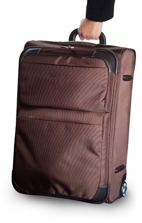 brown wheeled luggage isolated on whiteの写真素材