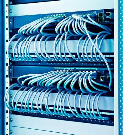 network rack with cables switches and patchの写真素材