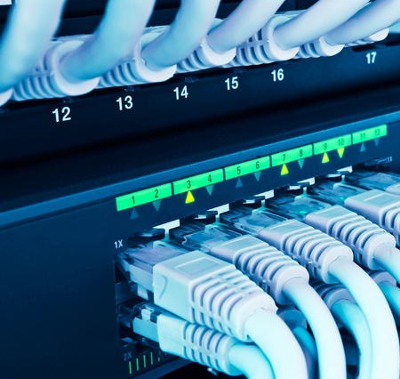 closeup of network hub and cables blue tonedの写真素材