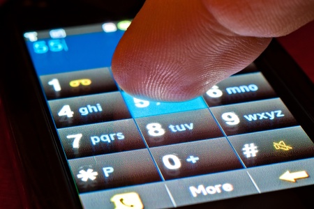finger dialing on touch screen smartphoneの写真素材