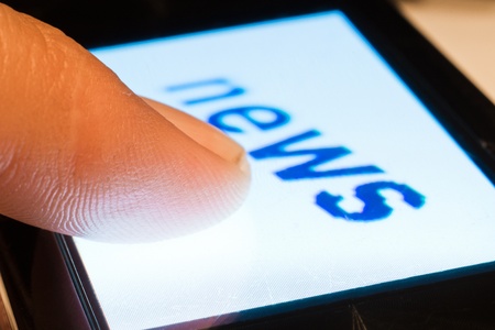 closeup of news on touch screen