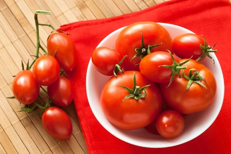 fresh tomatoes on red napkin from aboveの写真素材