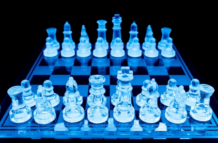 glass chess pieces before the game blue tonedの写真素材