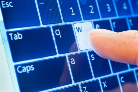 typing www on touch screen virtual keyboardの写真素材