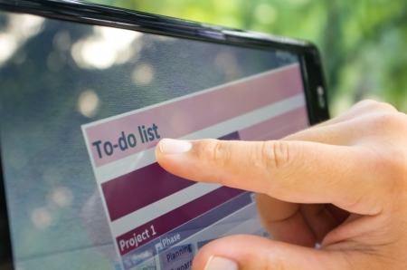 To do list on touchscreen tablet outdoorsの写真素材