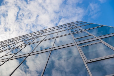 modern office building and sky witj clouds reflectionの写真素材