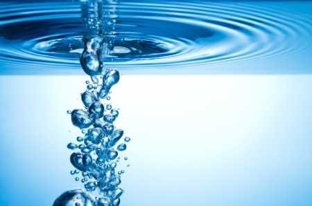 blue splashing water with bubbles underwater blue splashing water with bubbles underwater