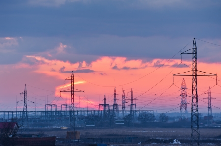 electric powerlines and pylons at duskの写真素材