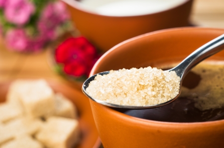 closeup of tablespoon with brown sugarの写真素材