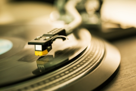 closeup shot of tonearm on the vinyl disc
