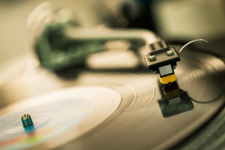 closeup shot of tonearm on the vinyl discの写真素材