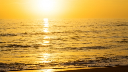golden sunrise on peaceful seaの写真素材