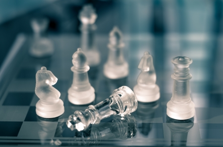 closeup of checkmate with glass chess and shallow depth of fieldの写真素材