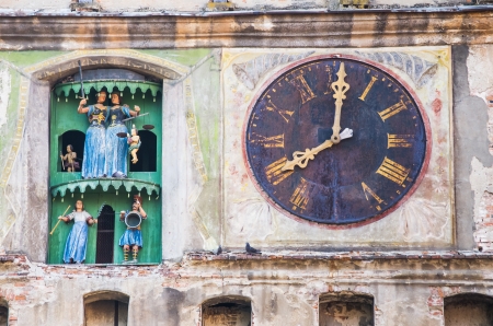 ancient clock on a medieval churchの写真素材