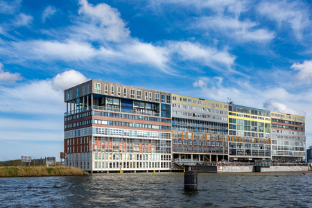 Unique modern design apartment building on the waterside 't IJ in Amsterdam the Netherlands.のeditorial素材