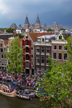 A view on the canals and the Rijksmuseum in Amsterdam the Netherlands.のeditorial素材