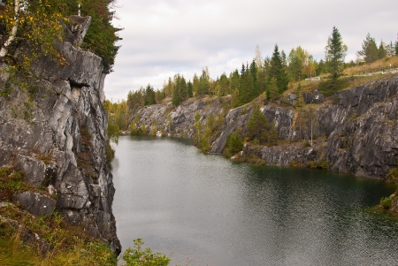 View of the forest lake in the rocks of marbleの写真素材