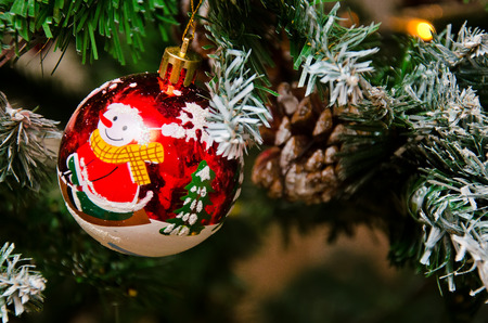 Christmas background. Pine cones and branch and garland.の写真素材