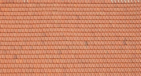 Red tiles roof background. Old clay tiles. Construction backgroundの写真素材