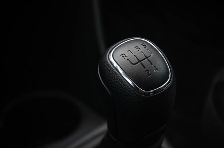 Gear shift handle in a modern car. Manual transmission. The gear change lever