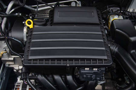 Photo of a new car engine covered with a plastic casingの写真素材