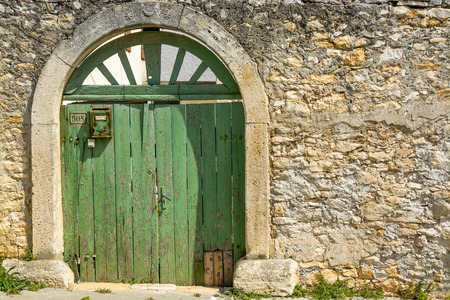 Green doors within an old building in Medulin, Istria, Croatiaの写真素材