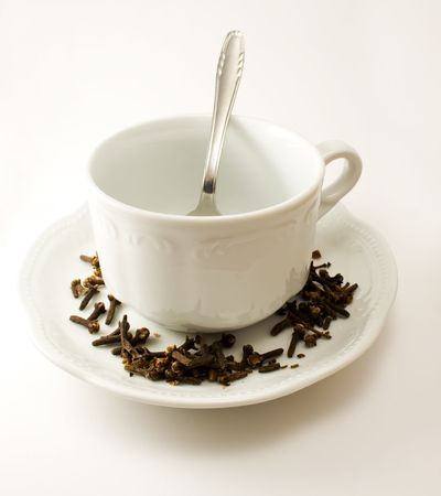 Empty tea cup with saucer, decoration and spoonの写真素材