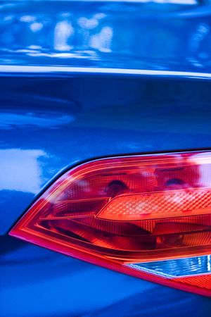Detail of rear light of a luxury car. With blue tint.