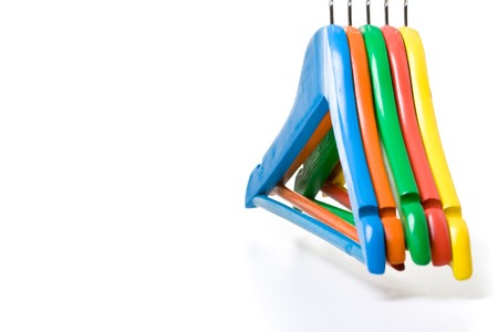 Colorful children clotheshangers isolated on white background.の写真素材