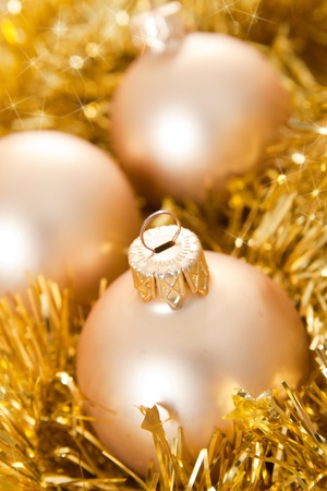 Gold Christmas baubles and ribbons for decoration.の写真素材