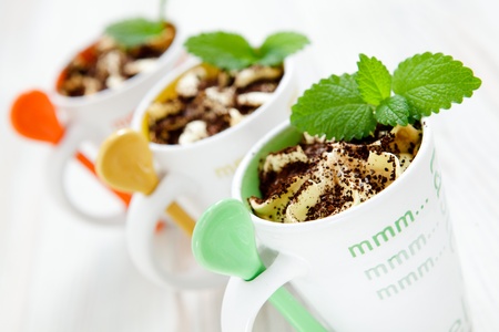 Delicious ice cream with colorful spoons and mint.の写真素材